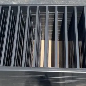 Metal bars arranged in parallel vertical lines.