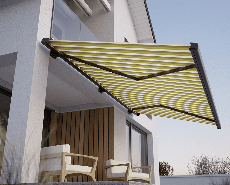 Yellow striped awning over outdoor patio chairs.
