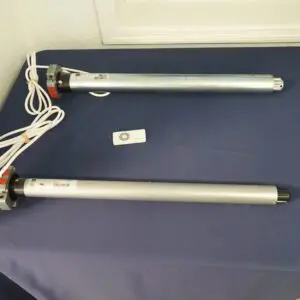 Two cylindrical devices with attached wires.