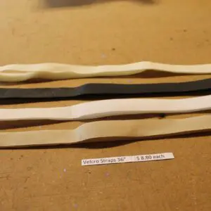 Velcro straps on wooden surface.