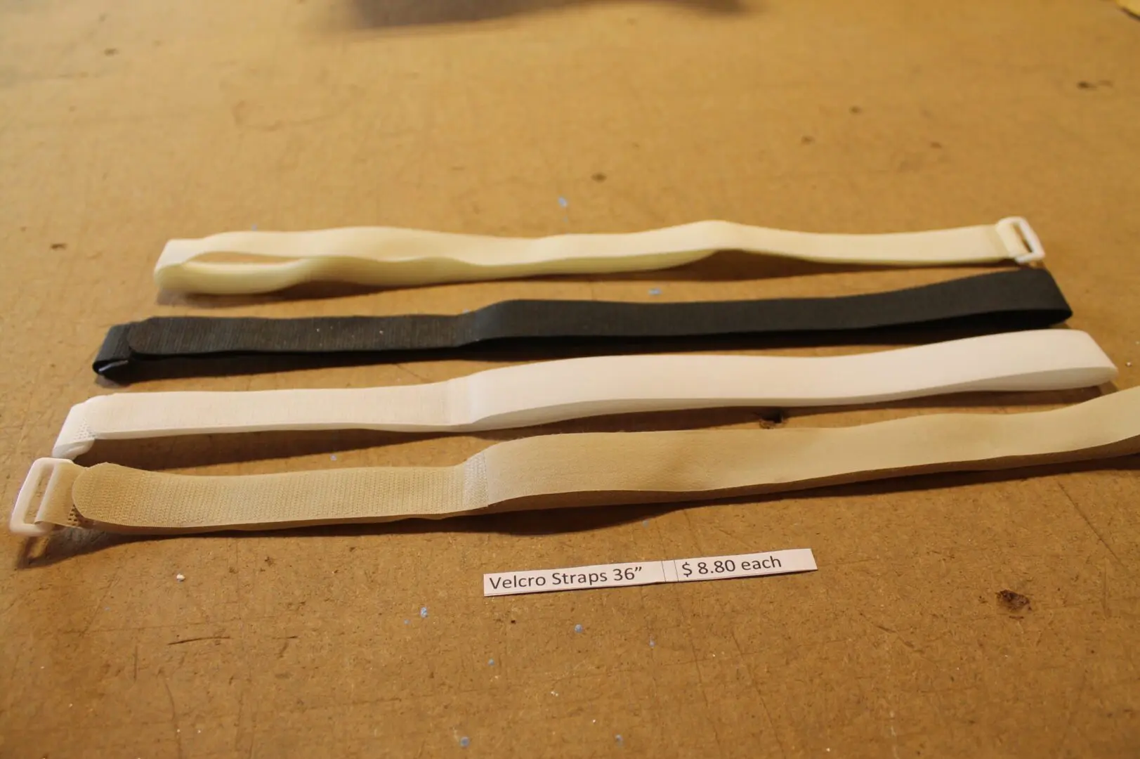 Velcro straps on wooden surface.