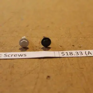 Two screws with price label displayed.
