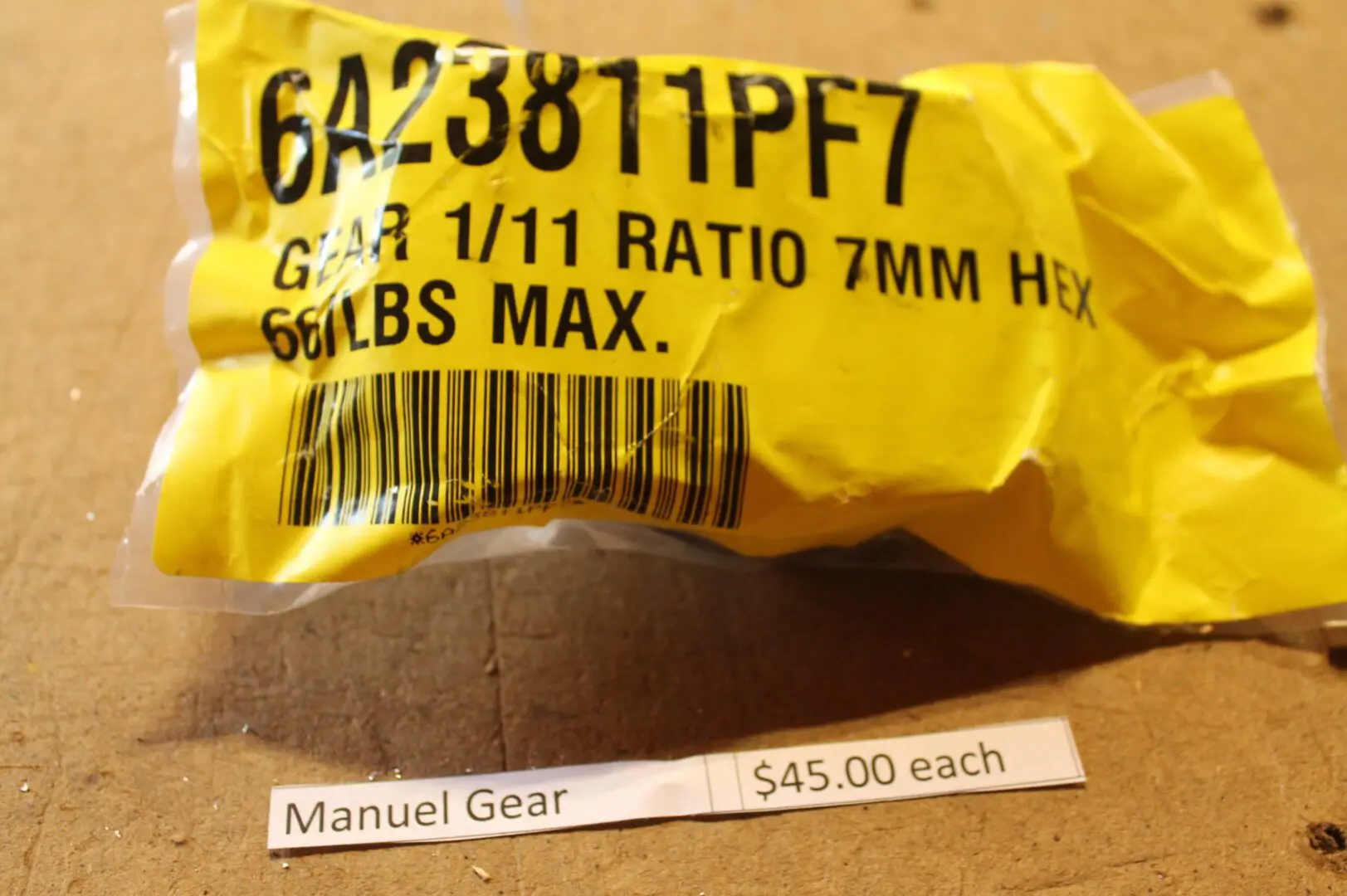 Yellow gear packaging with barcode and price.