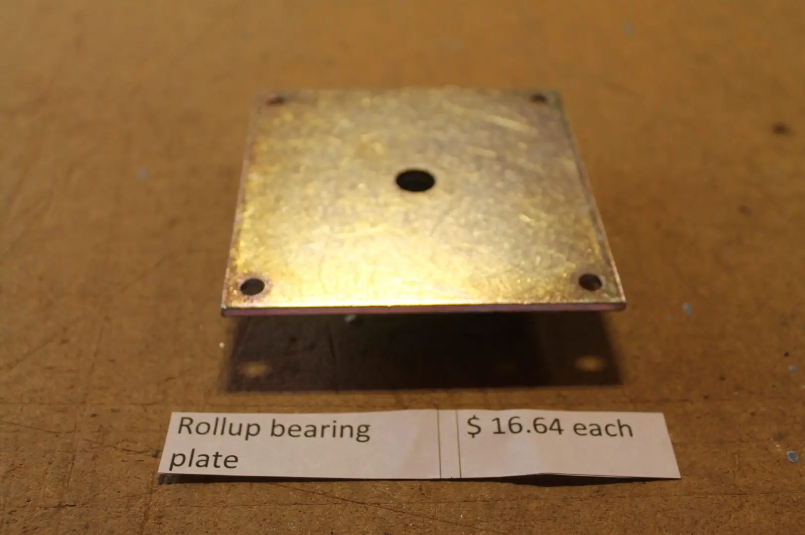 Metal rollup bearing plate with price tag.