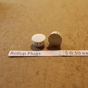 Rollup plugs on table with price tag.