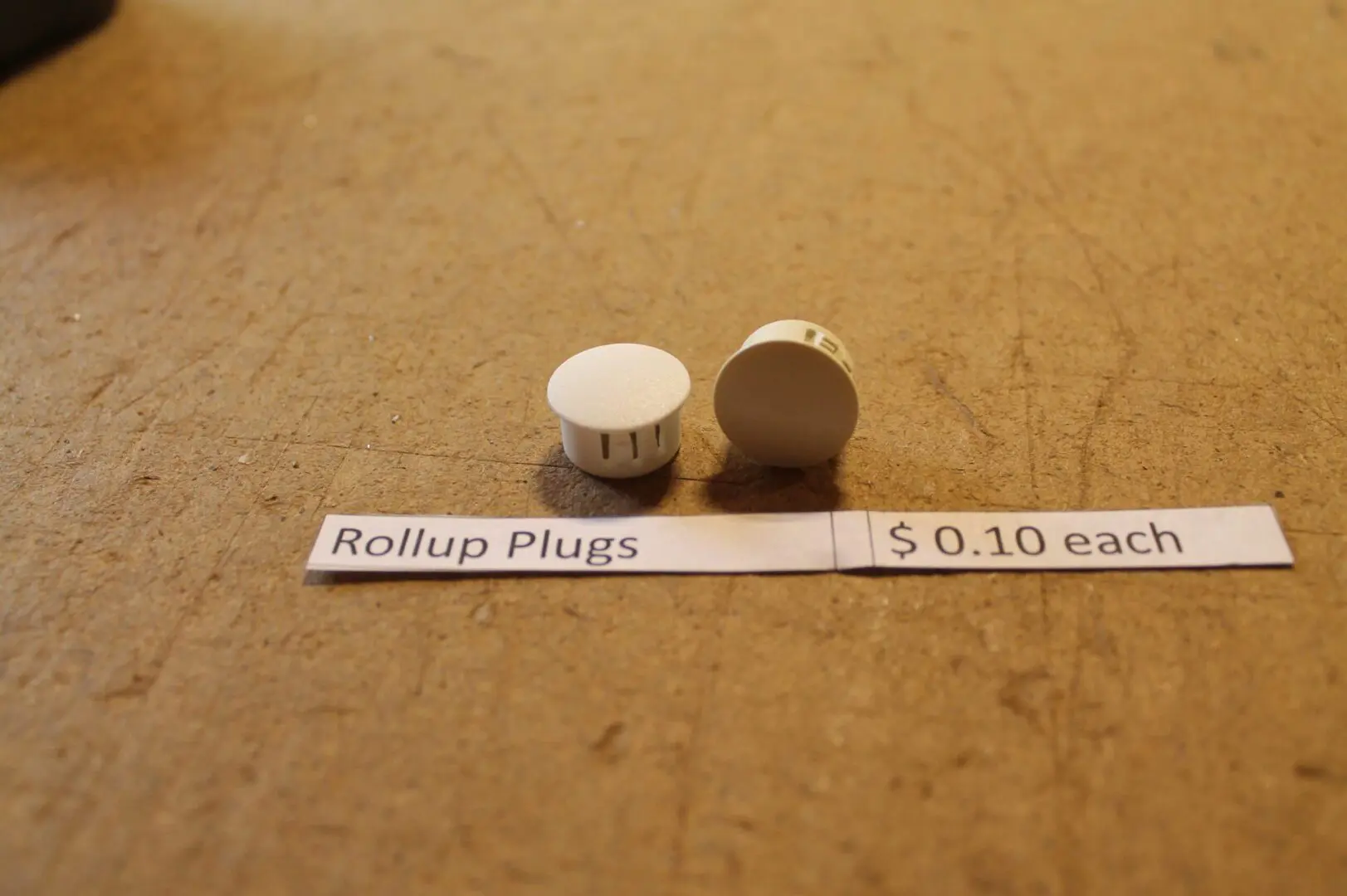 Rollup plugs on table with price tag.