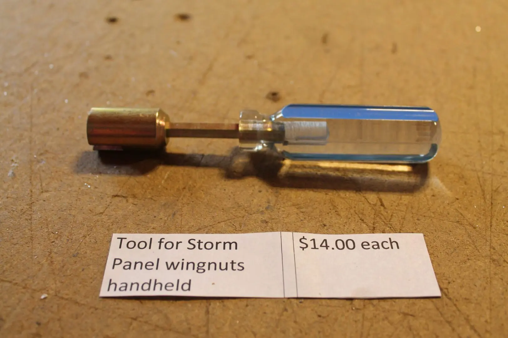 Handheld tool for storm panel wingnuts.