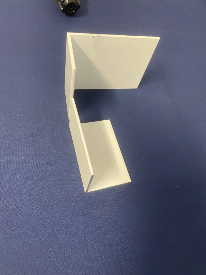 White geometric shapes on a blue background.