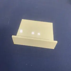 Small beige plastic card holder on table.