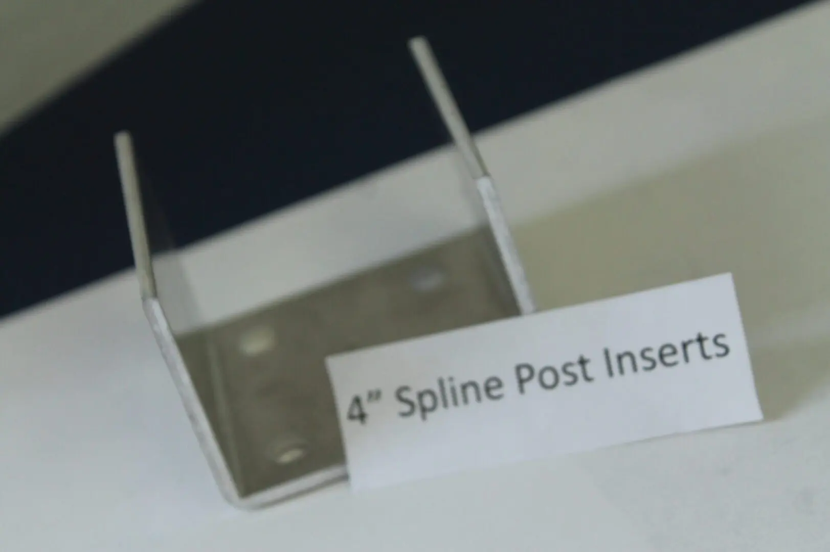 Metal bracket labeled "4-Inch Spline Post Inserts".