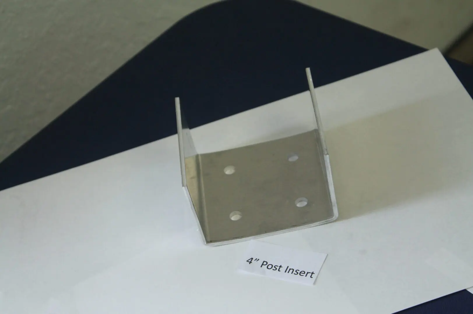 Metal bracket labeled "4-inch Post Insert".