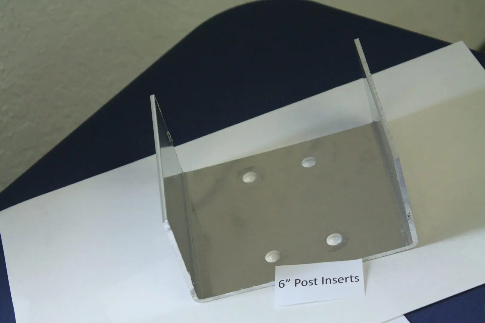 Metal bracket labeled "6-Inch Post Inserts".