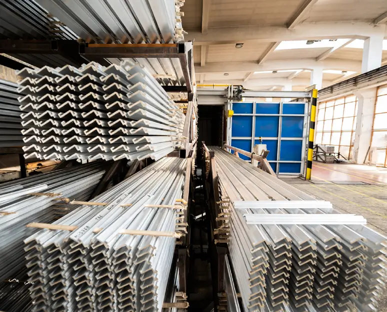 Stacked aluminum profiles in industrial warehouse
