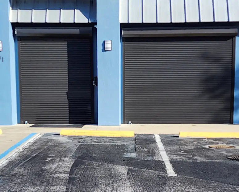 Two closed gray roll-up garage doors
